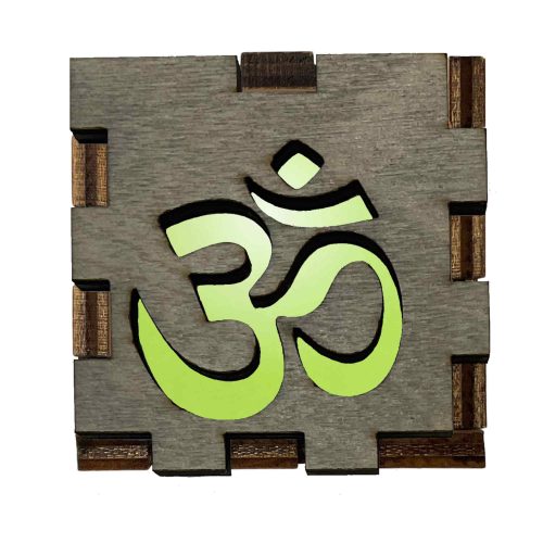 Om Interactive Light Box glowing on handcrafted wooden display cube