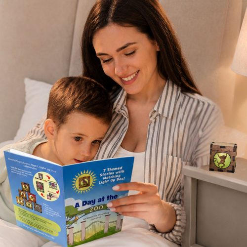 Adult and child sharing A Day at the Zoo Storybook together with an illuminated monkey Story Front on the Interactive Light Box nearby.