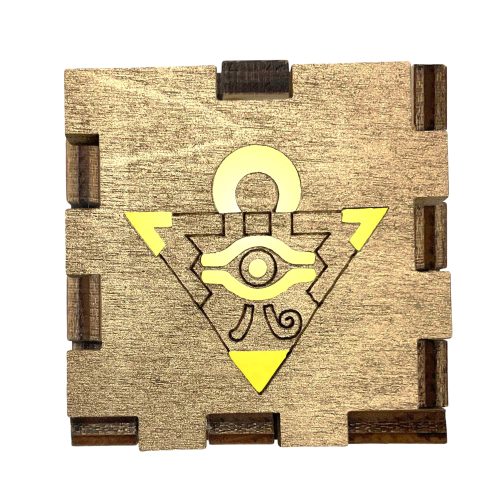 Yu-Gi-Oh Millennium Puzzle Interactive Light Box glowing on handcrafted wooden gaming desk display cube